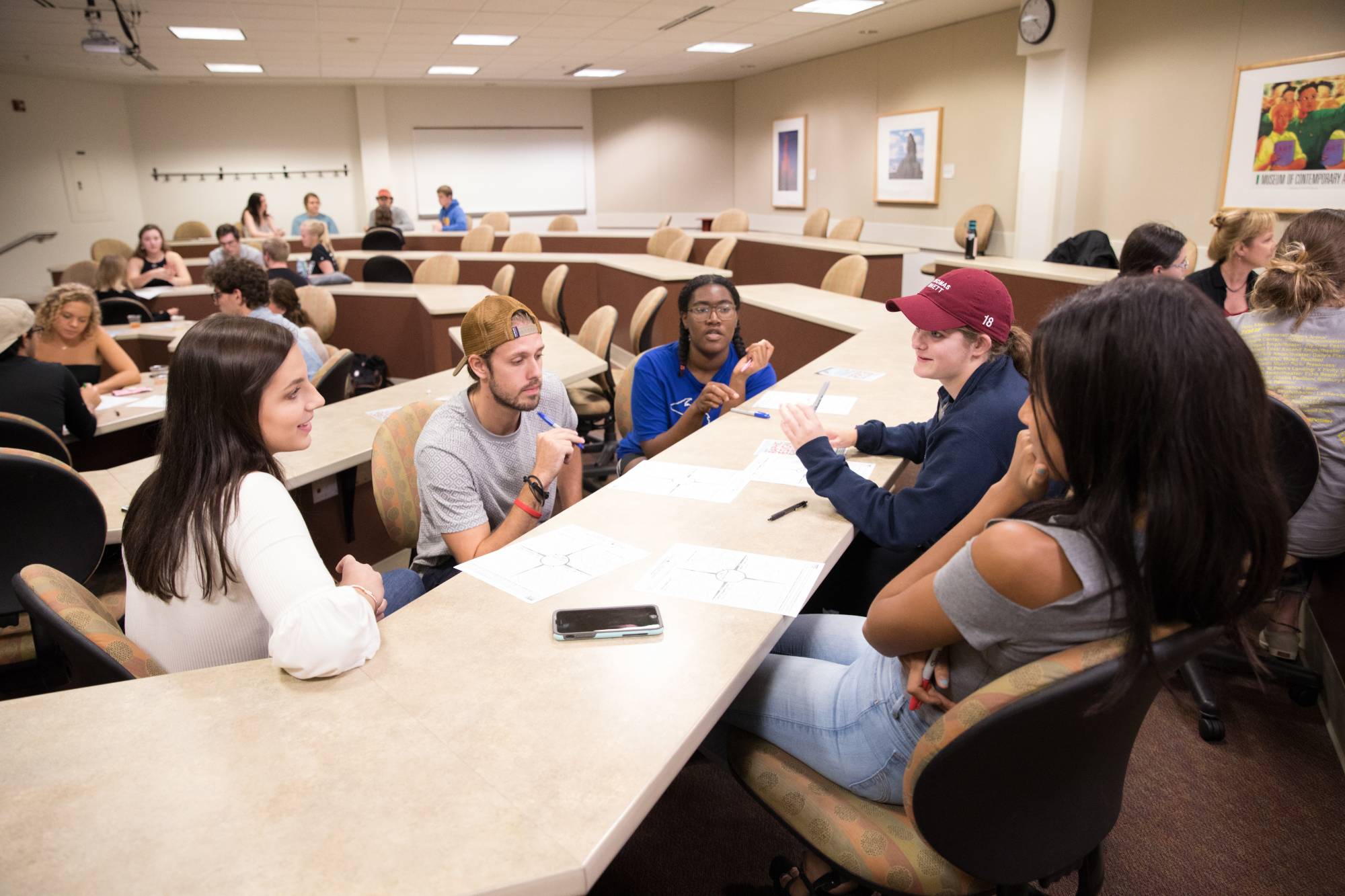 A group of students engage in design thinking.